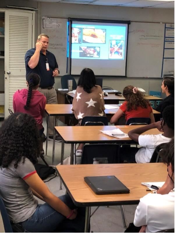 Driver's Ed Instructor teaching the course to students.